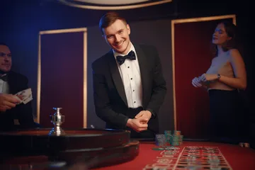 A cheerful woman in traditional clothing using her smartphone during a festive moment, showing how easily the ZBZBED app fits into everyday life.