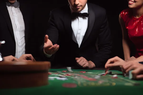 A glowing roulette wheel with cascading chips, symbolizing the engaging live and instant-win games available on ZBZBED.